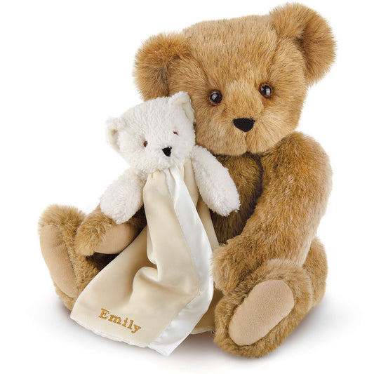 Honey brown plush teddy bear holding small cream white bear blanket with embroidered name "Emily".