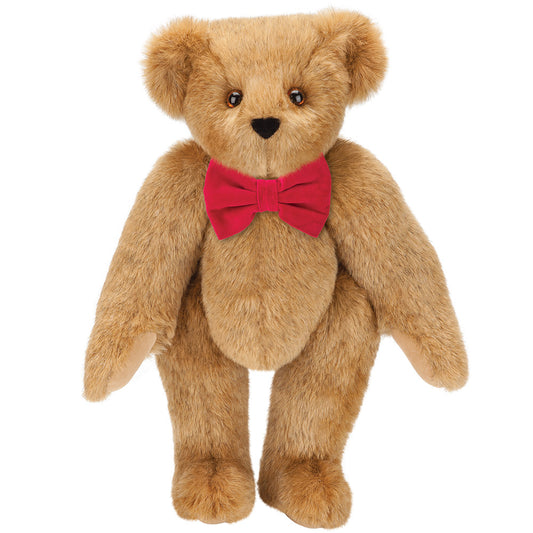 Honey-colored plush bear with brown eyes wearing a red classic bow tie, 15 inches tall.