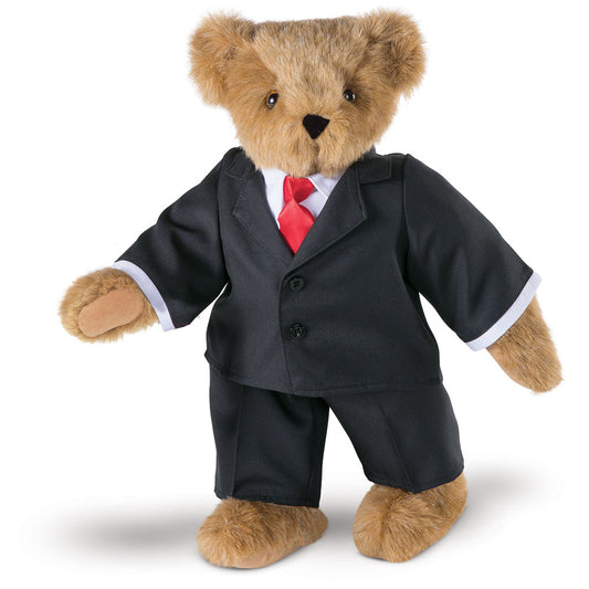 15-inch honey-colored teddy bear wearing a black suit and red tie with brown eyes.